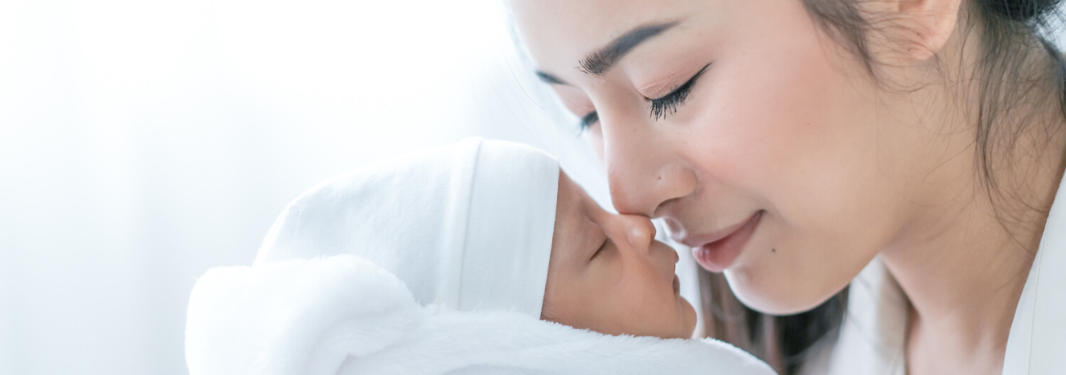 Mother holding newborn baby